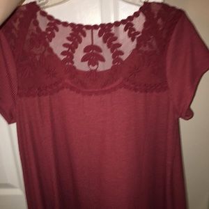 Maurice’s maroon top